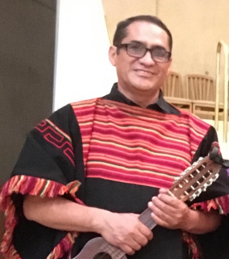 Miriam Mita performing on stage during a cultural music program